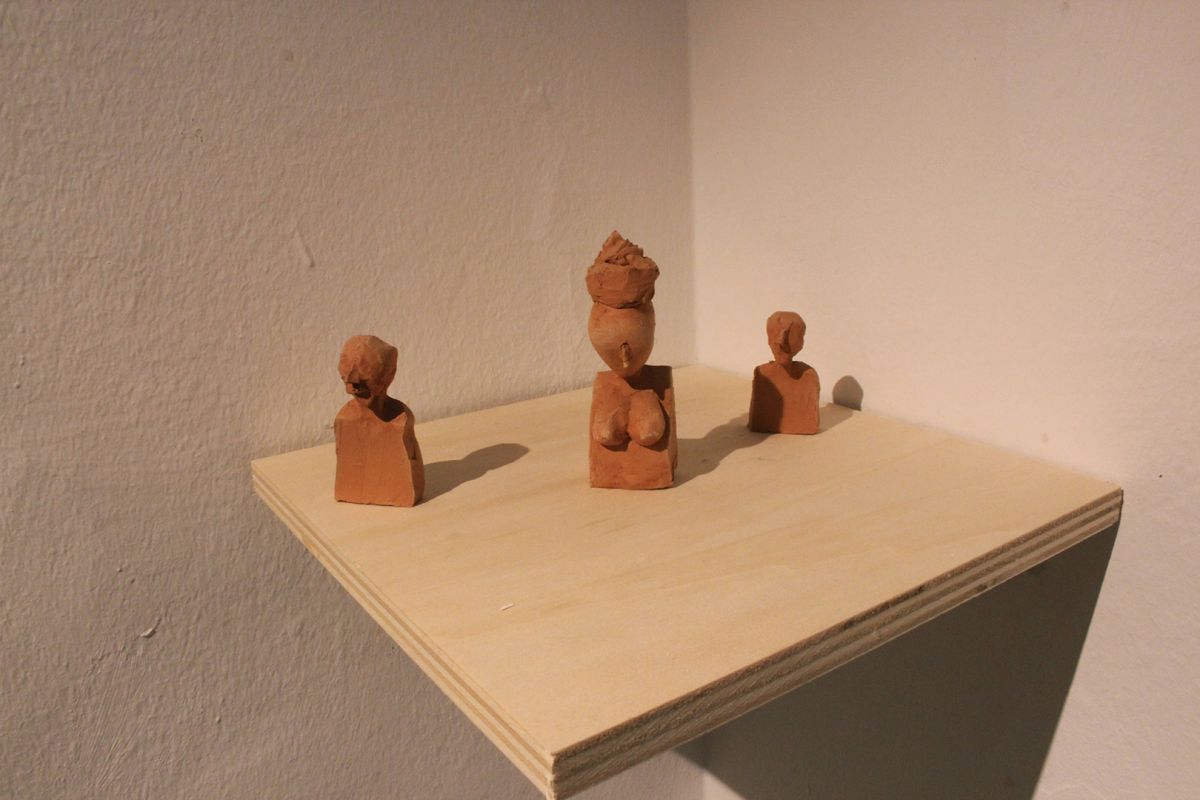 Sketches of characters in clay.