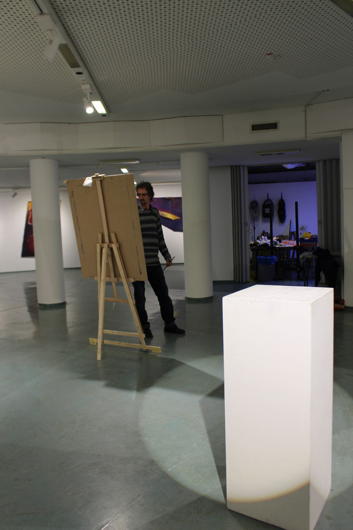 Painting a cube in charcoal.