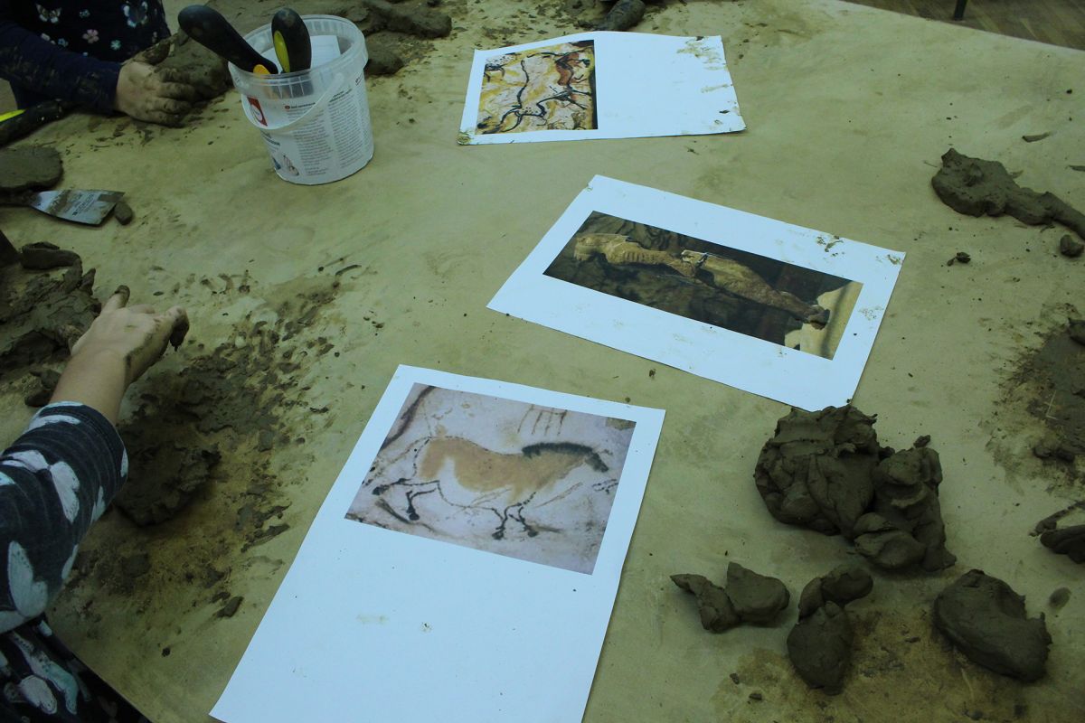 Animals of Prehistory in clay relief.
